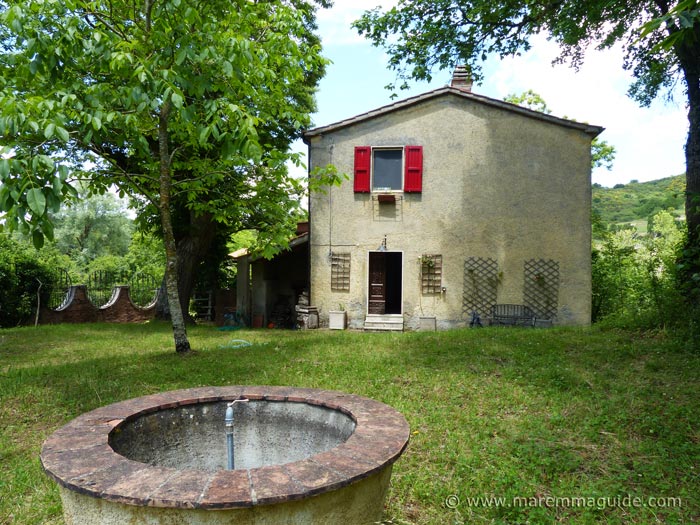 View of the house and well from the garden